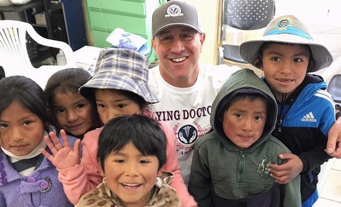 Dr. Doug with a group of children