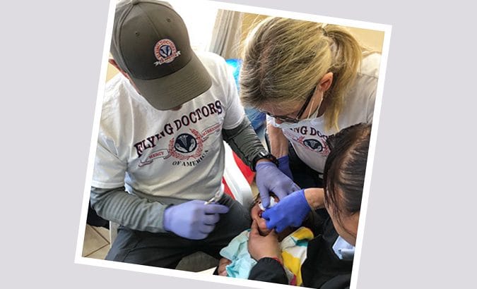 doctors performing a dental exam